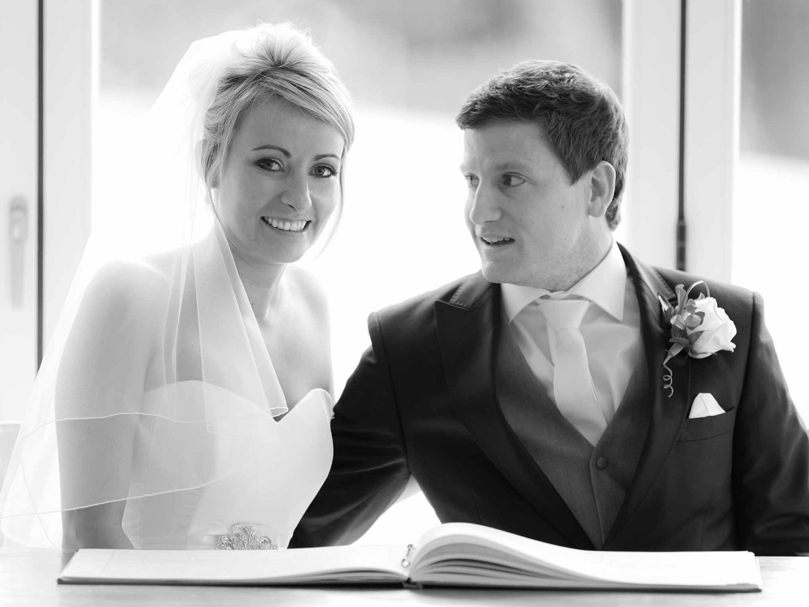 Wedding couple with registry book